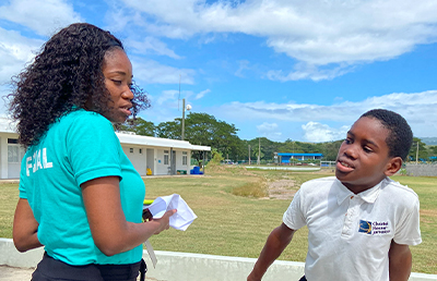Ms. Raymond speaks with a student